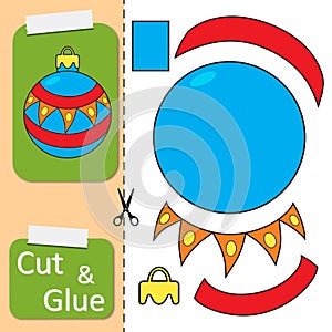 Cut and glue the paper New Year Ball toy. Create application the cartoon Christmas ball. Christmas winter holiday design element