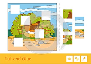 Cut and glue puzzle learning children game with color image of brood chicken sitting on eggs in nestle on countryside photo