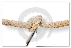 Cut the gordian knot - problem solving concept image with a ripped photo of a knot