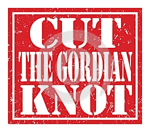 CUT THE GORDIAN KNOT, text written on red stamp sign