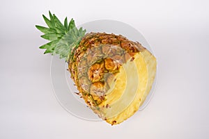 Cut half pineapple (Ananas)