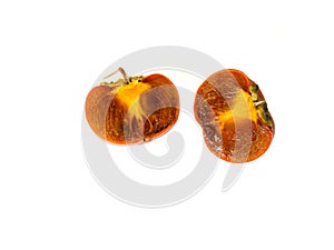 Cut in half ÃÂºipe persimmon on a white background