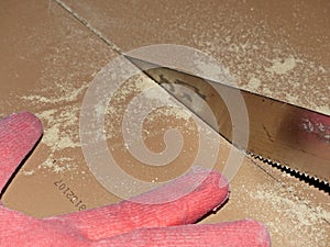 Cut the laminate by hand with a small hacksaw. The sheet of a hand saw should have very small and frequent teeths. photo