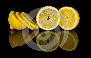 Cut lemon on black background