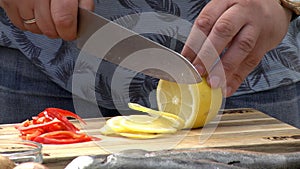 Cut lemon with a knife