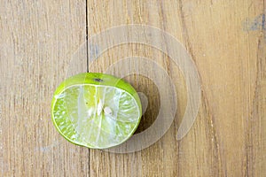 Cut lime on wooden board