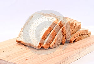 The cut loaf of bread on white Background