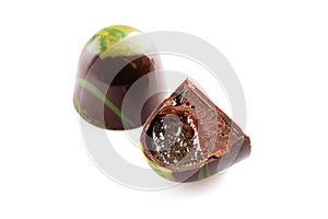 Cut luxury handmade bonbon with chocolate ganache and fruit jell