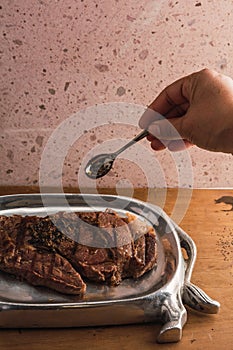 Cut of meat `Aguja norteÃÂ±a Sonora`, served on a silver plate in the shape of a cow 14 photo