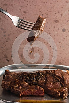 Cut of meat `Aguja norteÃÂ±a Sonora`, served on a silver plate in the shape of a cow 5 photo