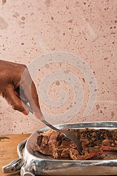 Cut of meat `Aguja norteÃÂ±a Sonora`, served on a silver plate in the shape of a cow 4 photo
