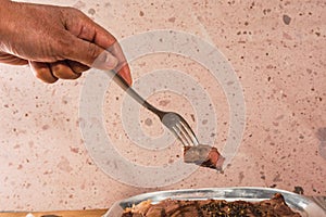 Cut of meat `Aguja norteÃÂ±a Sonora`, served on a silver plate in the shape of a cow 2 photo