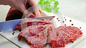 Cut meat in white kitchen