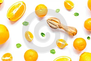 Cut oranges for juicy breakfast on white background top view pat