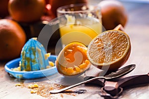 Cut oranges. Pressed orange manual method. Oranges and sliced oranges with juice and squeezer.