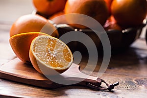 Cut oranges. Pressed orange manual method. Oranges and sliced oranges with juice and squeezer.