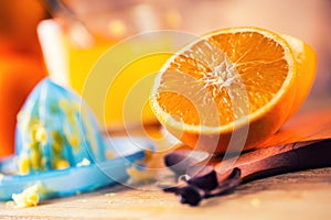 Cut oranges. Pressed orange manual method. Oranges and sliced oranges with juice and squeezer.