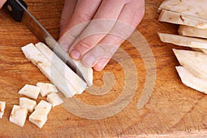 Cut organic celery, knife