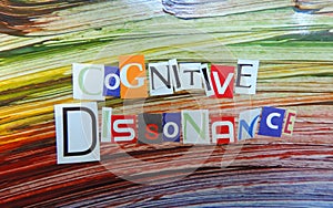 Cut out colored letters from magazines and compilation of cognitive dissonance