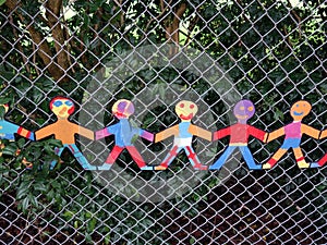 Cut out models of children holding hands