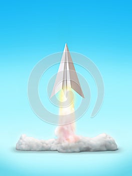 Cut-out object shot of a paper airplane rocket launch isolated on a blue background