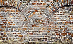 Cut out rocks in wall with arched brickwork