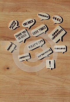 Cut out words on wood background