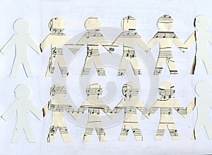 Cut paper on an old music sheet.