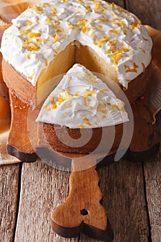 Cut a piece of cake Tres leches closeup on a table. vertical photo