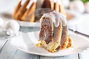 A cut piece of Easter marble cake on a white plate