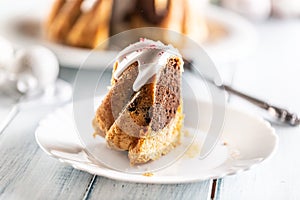 A cut piece of Easter marble cake on a white plate