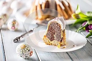 A cut piece of Easter marble cake on a white plate