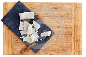 Cut pieces of feta cheese and fork