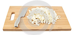 Cut in pieces white cabbage over cutting board