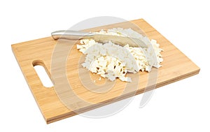 Cut in pieces white cabbage over cutting board