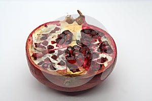Cut pomegranate. Pomegranate cut. Slice of pomegranate.