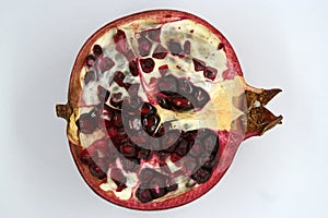 Cut pomegranate. Pomegranate cut. Slice of pomegranate.