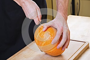 Cut pumpkin in kitchen