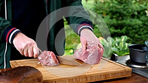 Cut raw pork.