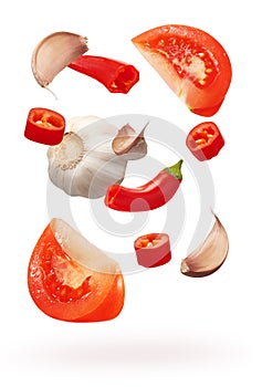 Cut red chili pepper vegetables, garlic and slices of tomato