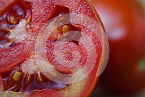 Cut red tomato with seeds