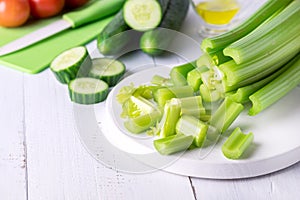 Cut Ripe Fresh Celery on White Cutting Board Healthy Diet Food Cucumber Vegetables