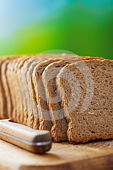 Cut rye bread and knife