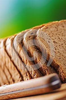 Cut rye bread and knife