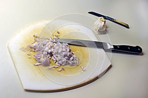 cut shallots on a chopping board