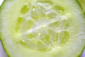 Cut slice of fresh and delicious cucumber close up