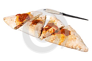 Cut and sliced Calzone closed pizza with ham and cheese Isolated on white background, top view.