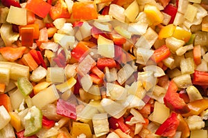 Cut slices pieces of red, yellow and green sweet bell pepper