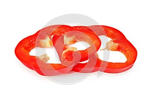 cut slices of red sweet bell pepper isolated on white background