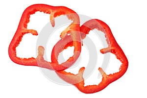 cut slices of red sweet bell pepper isolated on white background. top view